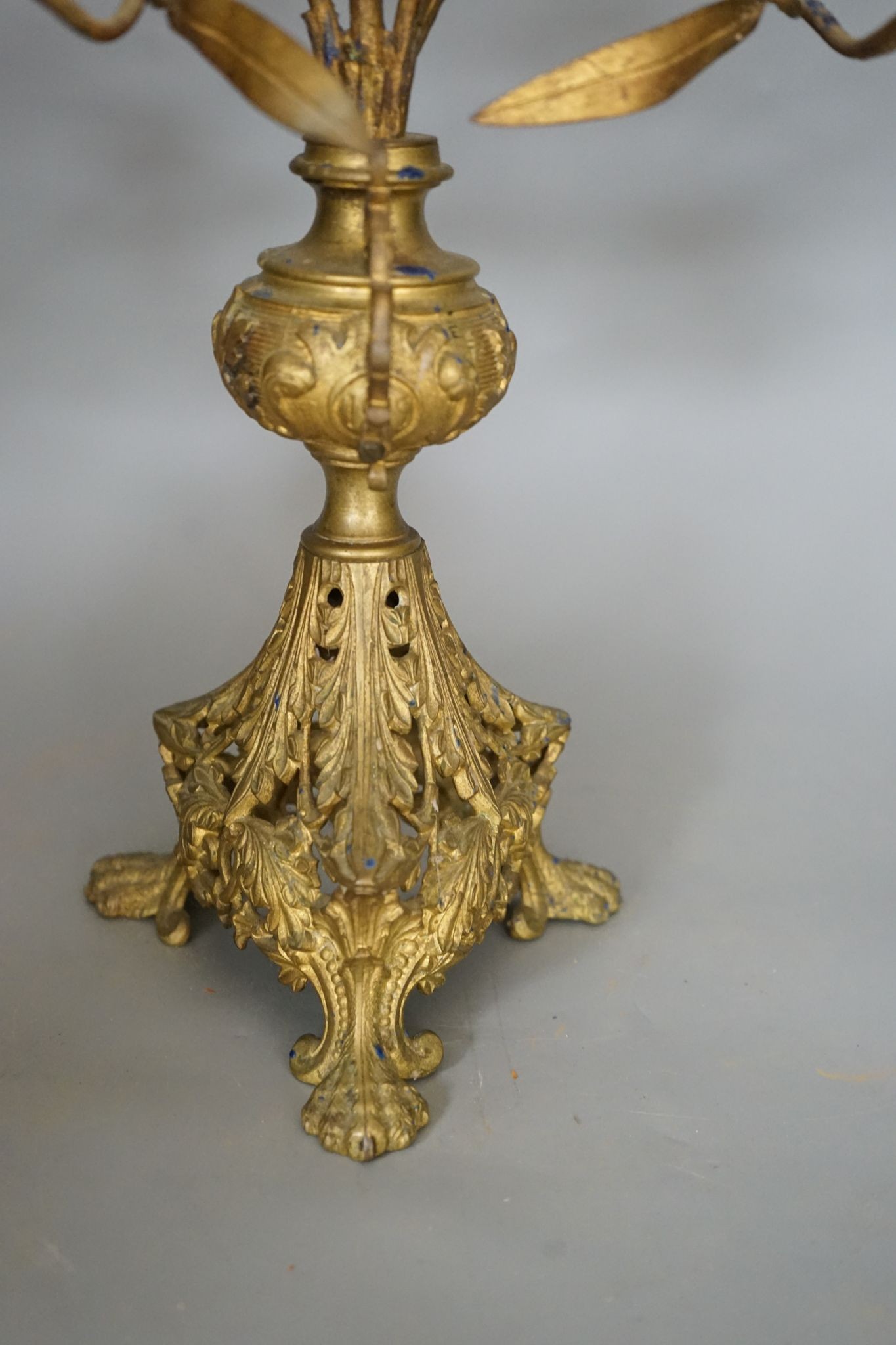 A Victorian cast gilt metal candelabrum, mounted with glass flower heads